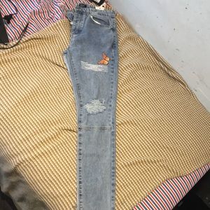 TALL SKINNY BUTTERFLY JEAN WITH KNEE RIP